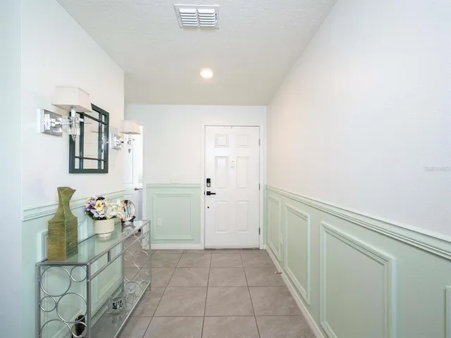 a bathroom with a sink mirror and vanity