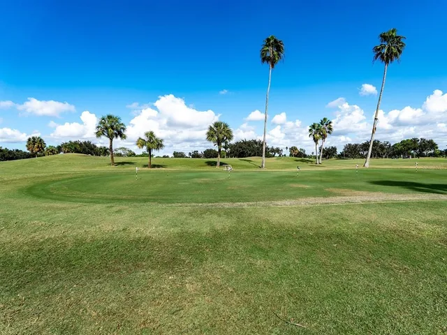 an aerial view of a house with a swimming pool patio and outdoor seating