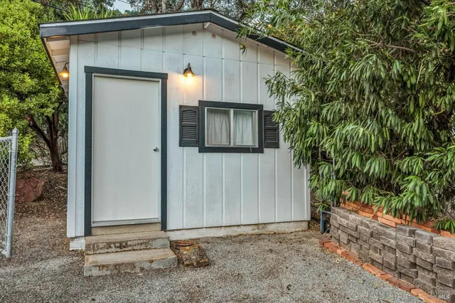 a bed room with a bed and a chandelier