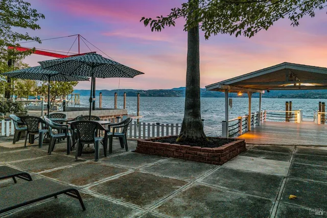 a front view of house with yard and outdoor seating
