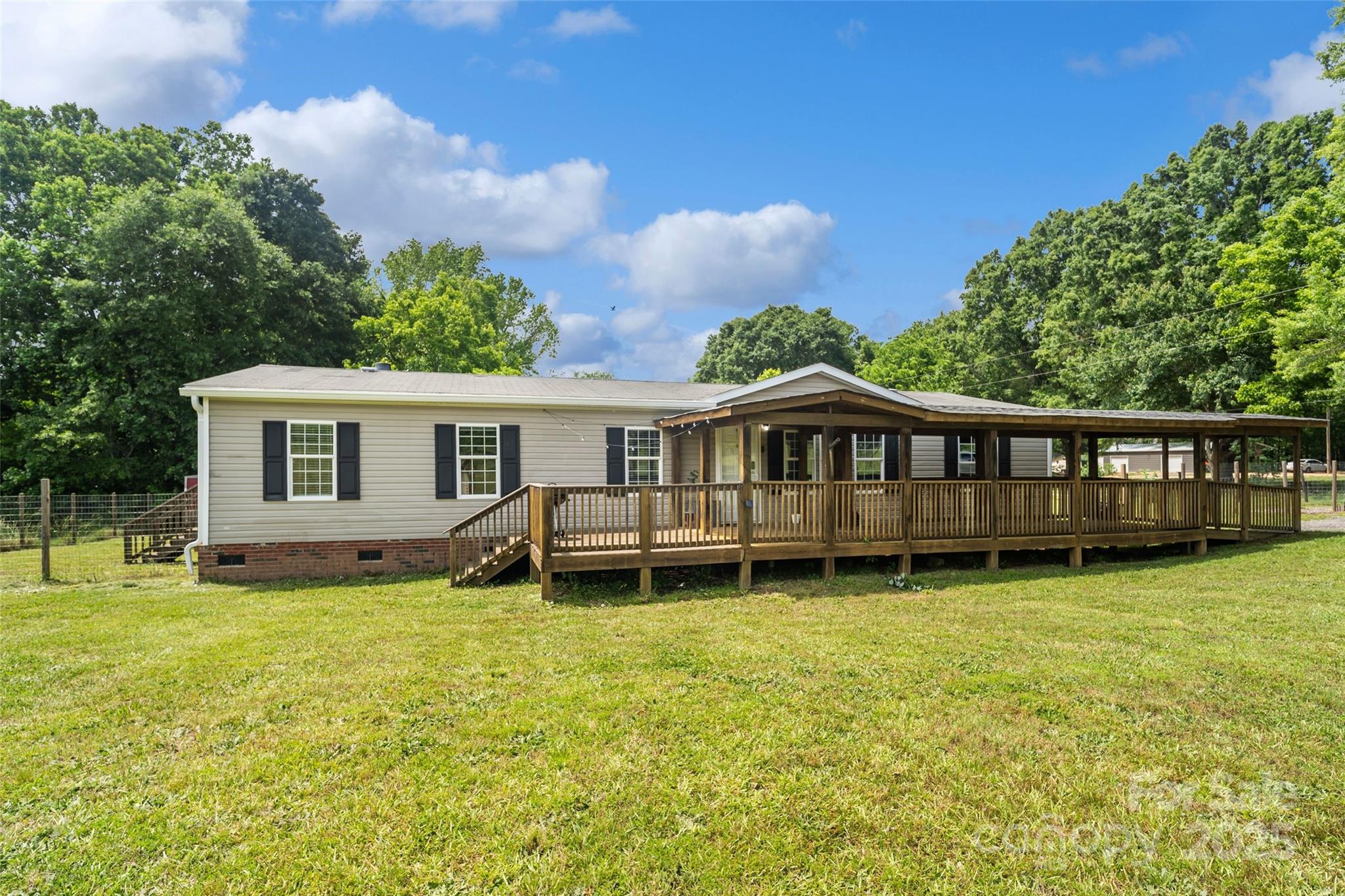 a view of a house with a yard porch and sitting area