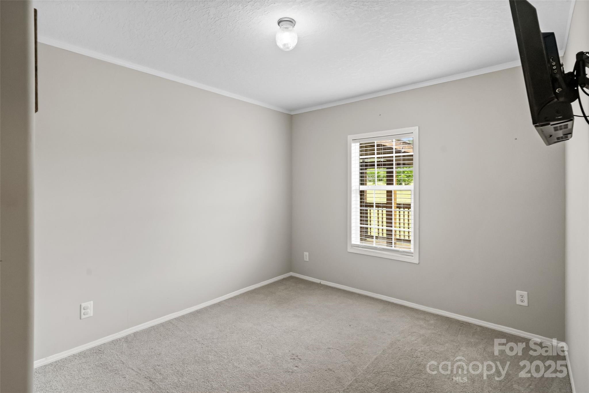 2021 Beamguard Road Clover, SC 29710 - Photo 12 of 33 an empty room with a window
