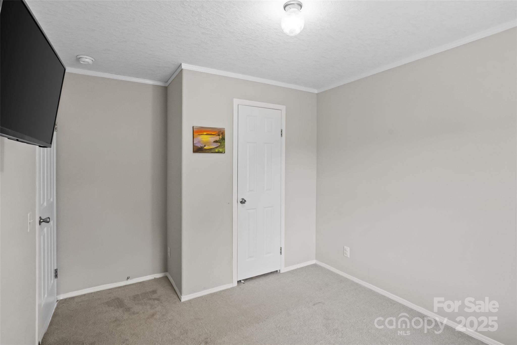 2021 Beamguard Road Clover, SC 29710 - Photo 13 of 33 a view of a livingroom with wooden floor and a flat screen tv