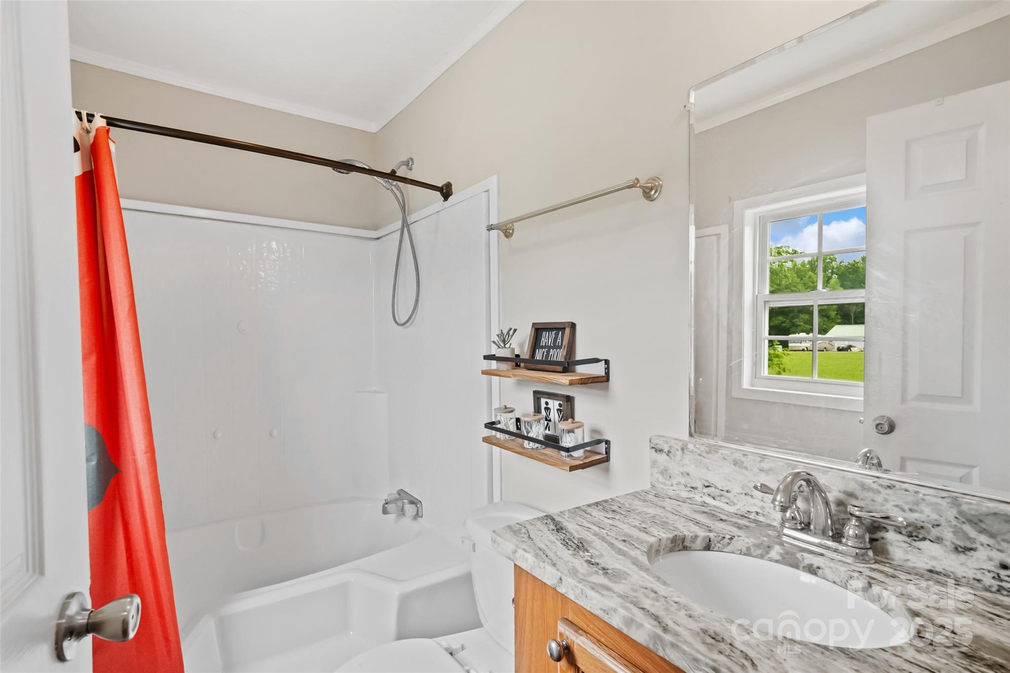 2021 Beamguard Road Clover, SC 29710 - Photo 14 of 33 a bathroom with a granite countertop sink a mirror and a shower