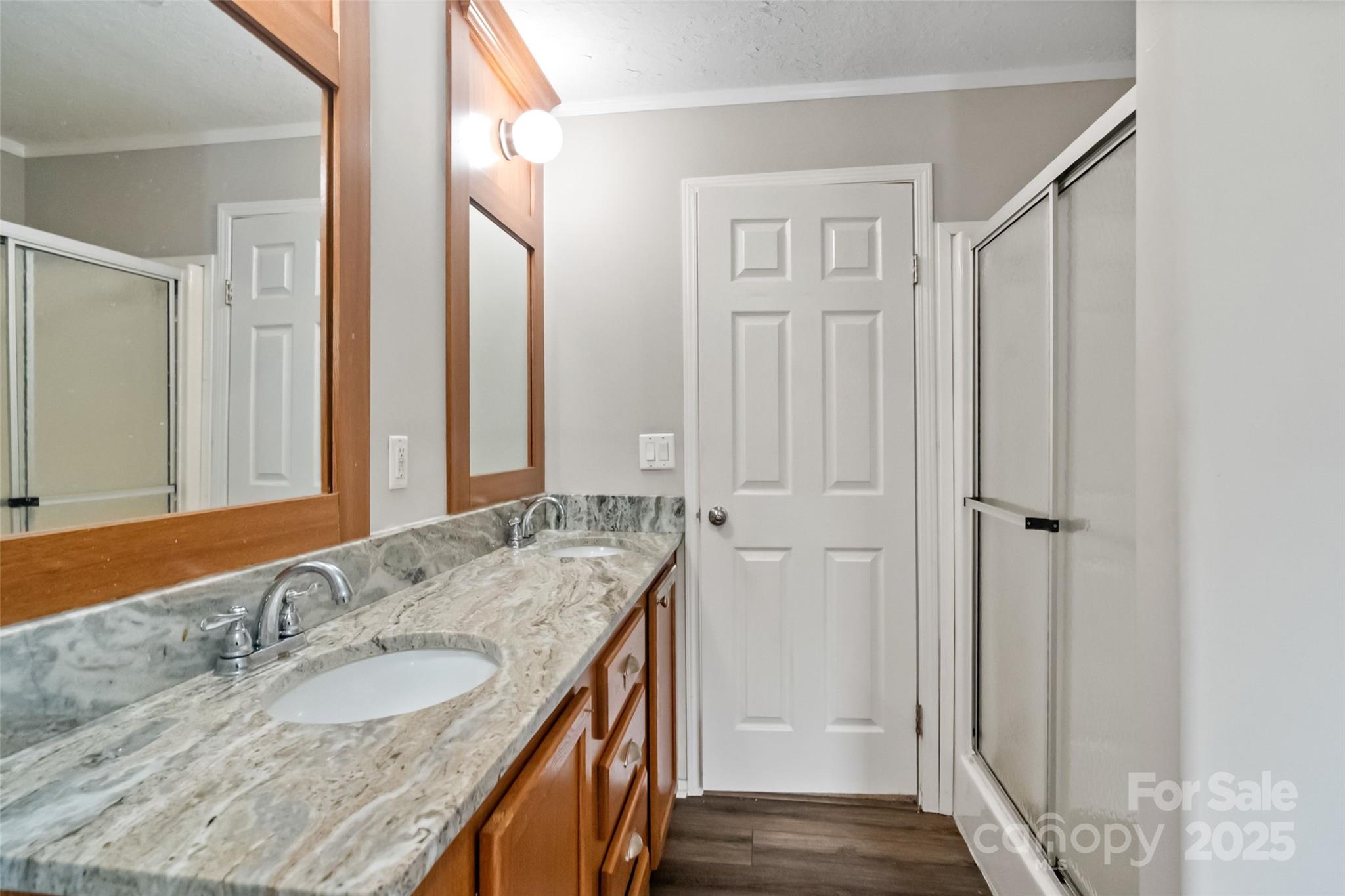2021 Beamguard Road Clover, SC 29710 - Photo 18 of 33 a bathroom with a granite countertop double vanity sink and mirror