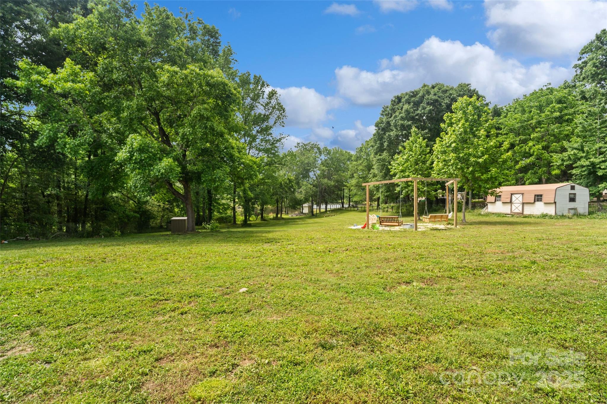 2021 Beamguard Road Clover, SC 29710 - Photo 29 of 33 a view of a field with a trees in the background