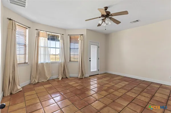 a view of an empty room and window