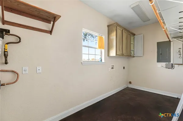 a view of a room with wooden floor and stairs