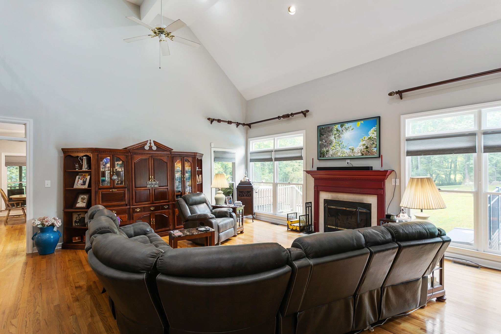 830 Baker Road Columbia, TN 38401 - Photo 12 of 68 a living room with furniture a fireplace and a floor to ceiling window