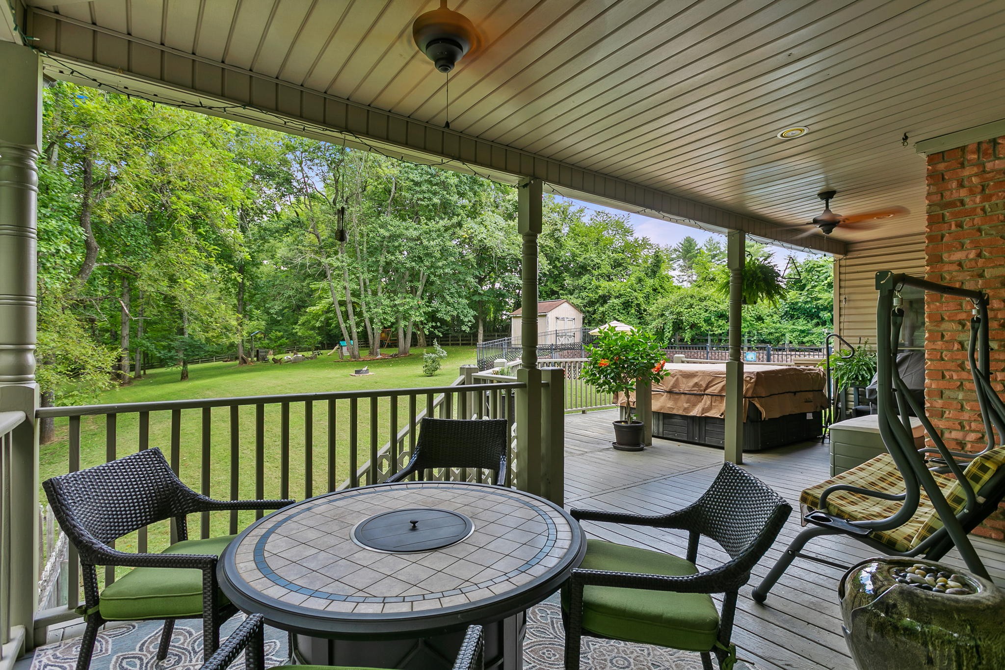830 Baker Road Columbia, TN 38401 - Photo 39 of 68 a view of a patio with a table chairs and a backyard