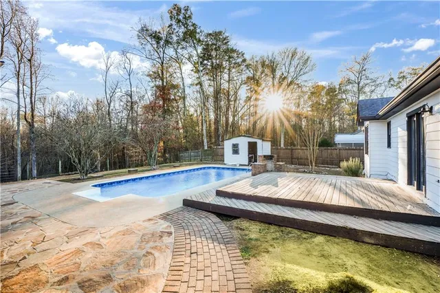 a view of a swimming pool with a house
