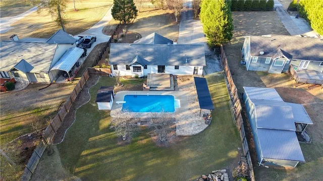 a view of swimming pool with seating area