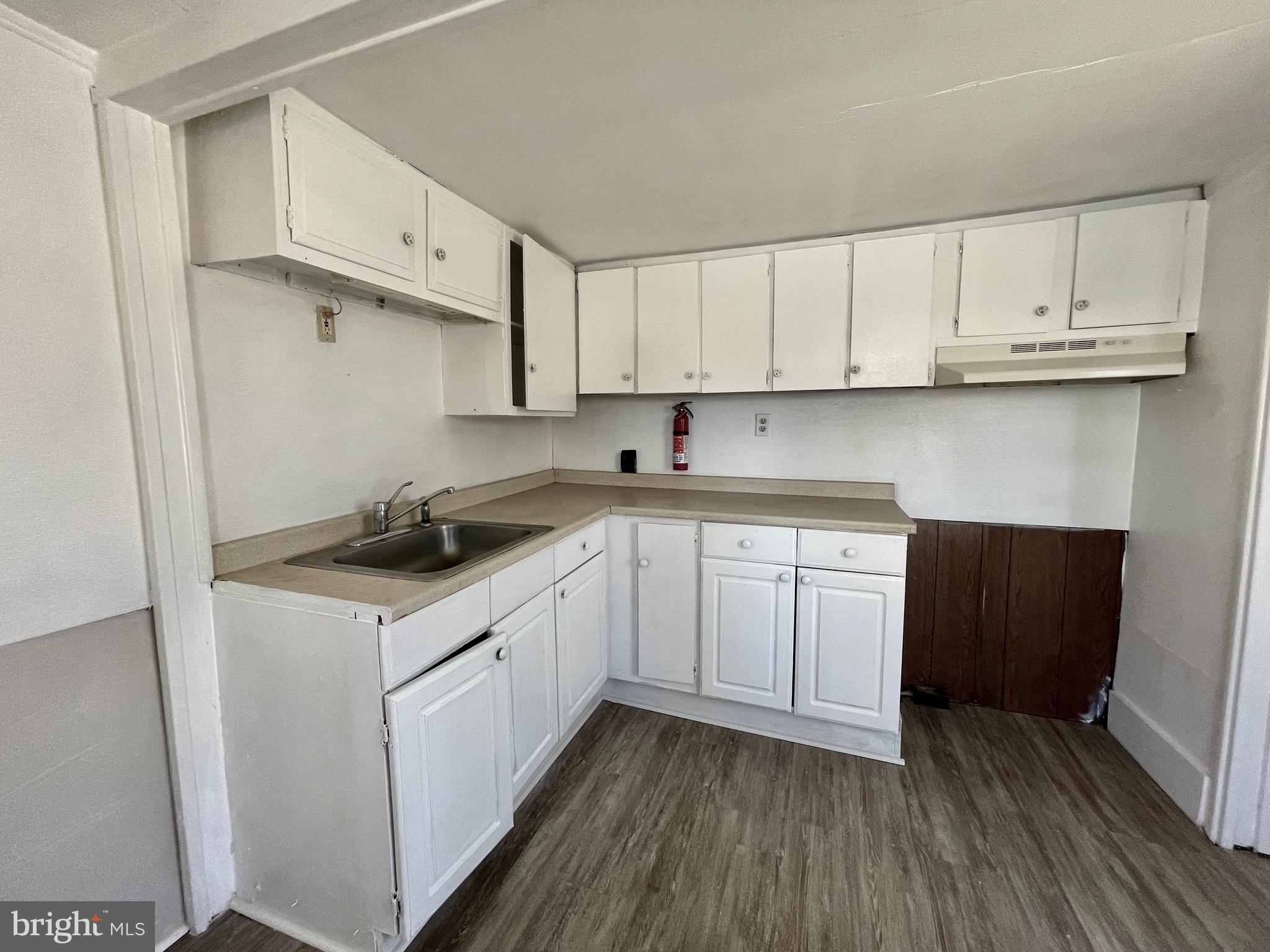 542 Gooseberry Road Millville, NJ 08332 - Photo 5 of 16 a kitchen with cabinets stainless steel appliances a sink and wooden floor