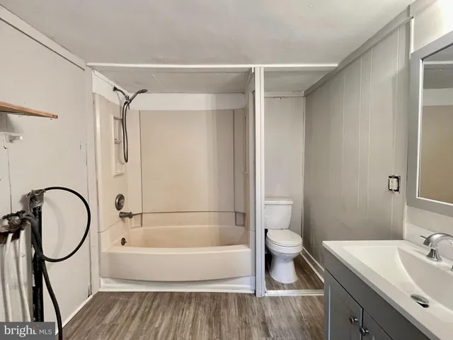 a bathroom with a sink toilet and a bathtub