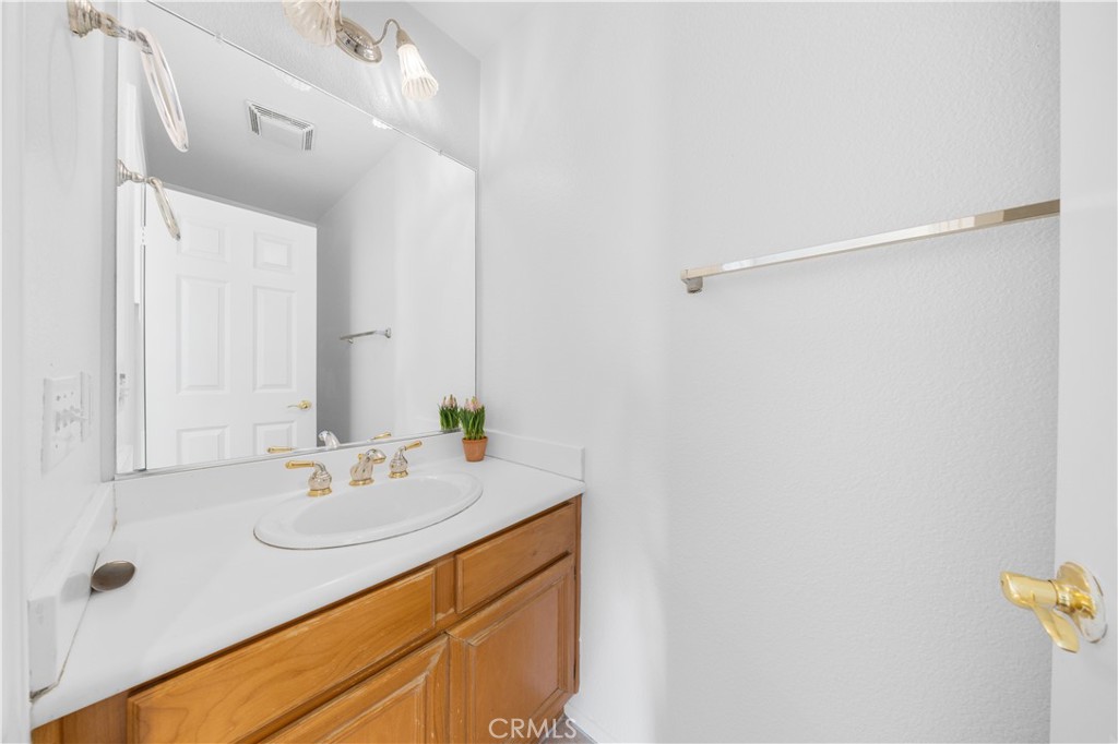 8679 Cabin Place Riverside, CA 92508 - Photo 13 of 35 a bathroom with a sink and a mirror