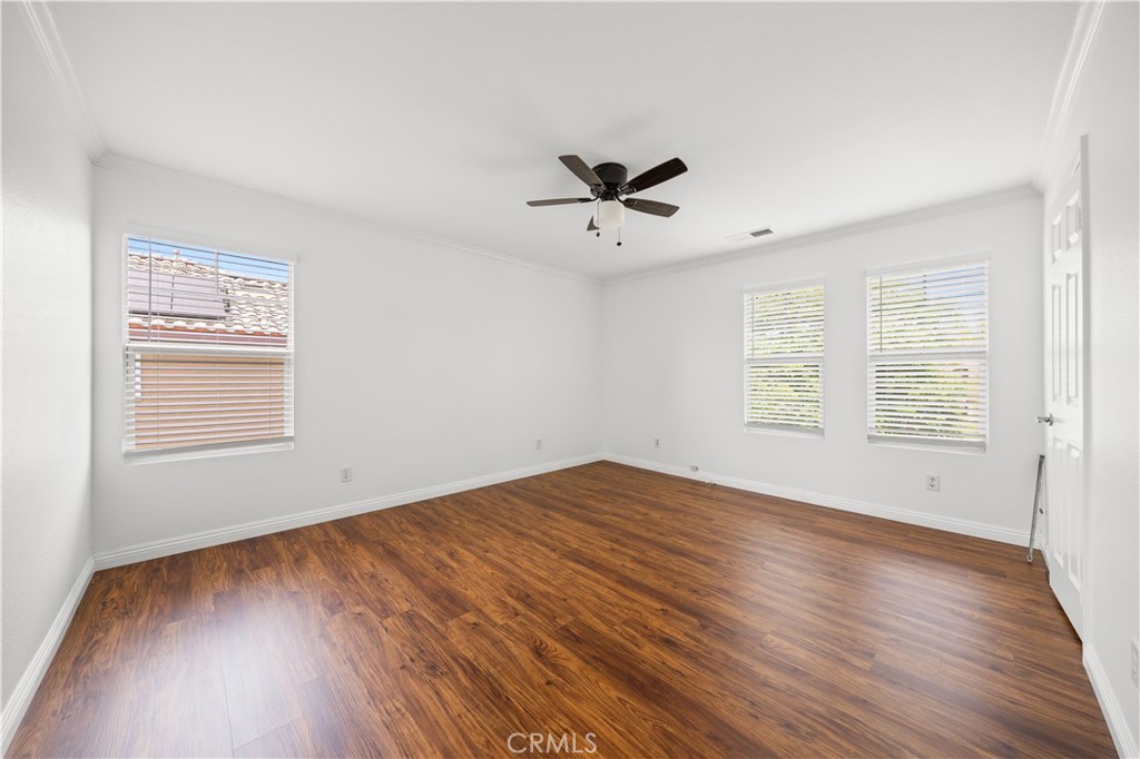 8679 Cabin Place Riverside, CA 92508 - Photo 17 of 35 a view of empty room with wooden floor and fan
