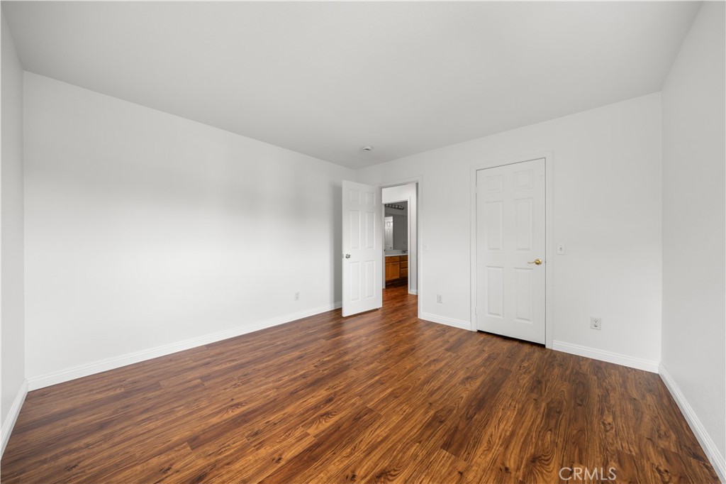 8679 Cabin Place Riverside, CA 92508 - Photo 18 of 35 a view of an empty room and wooden floor