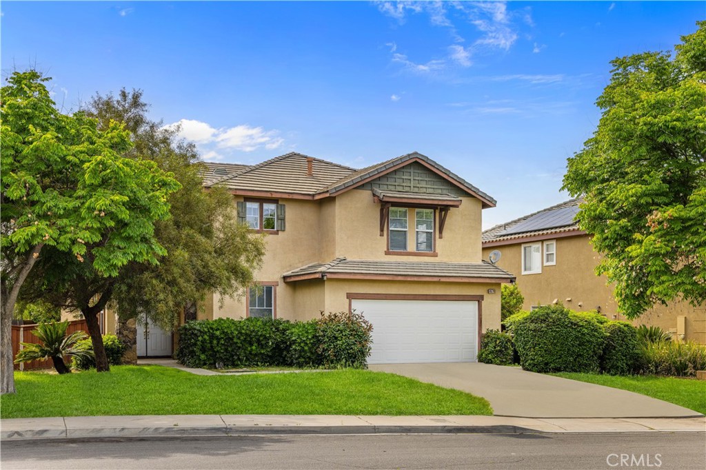 8679 Cabin Place Riverside, CA 92508 - Photo 2 of 35 a front view of a house with a yard
