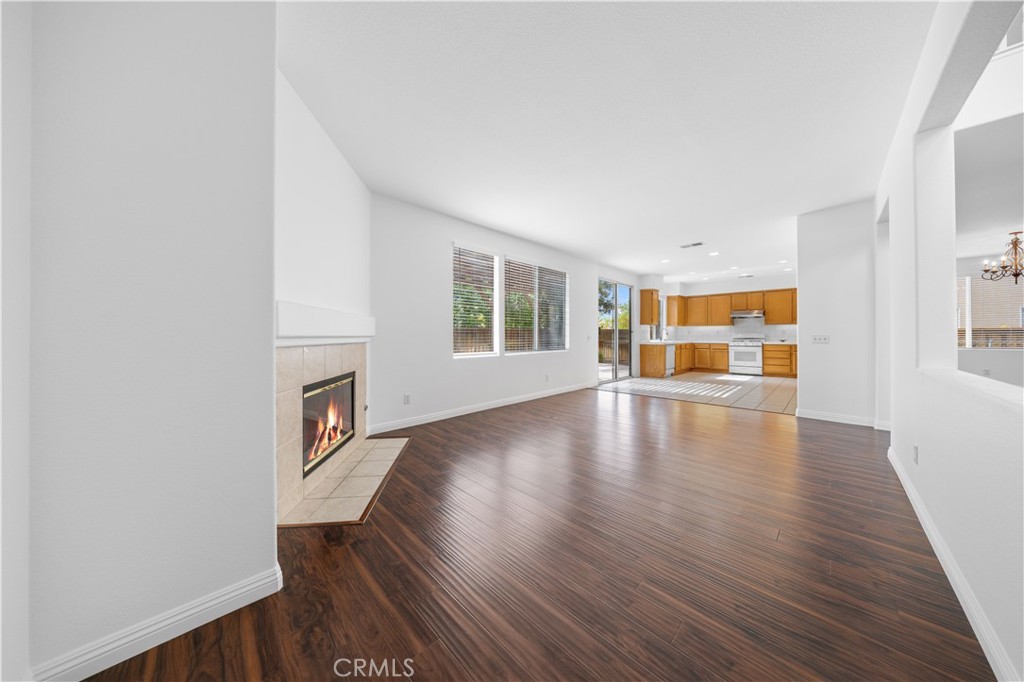 8679 Cabin Place Riverside, CA 92508 - Photo 21 of 35 wooden floor in an empty room with a window