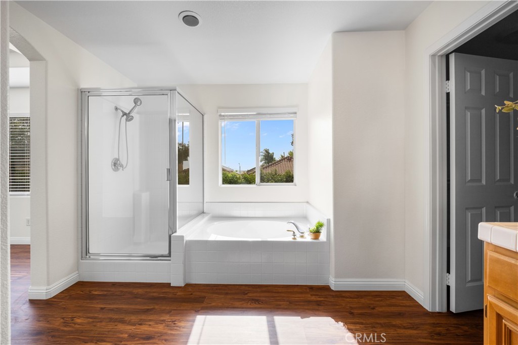 8679 Cabin Place Riverside, CA 92508 - Photo 23 of 35 a view of a bathroom with bathtub and shower
