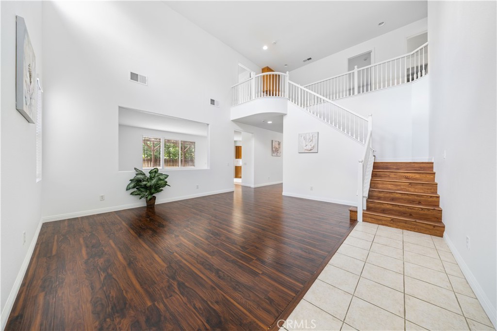 8679 Cabin Place Riverside, CA 92508 - Photo 3 of 35 wooden floor in an empty room with a window
