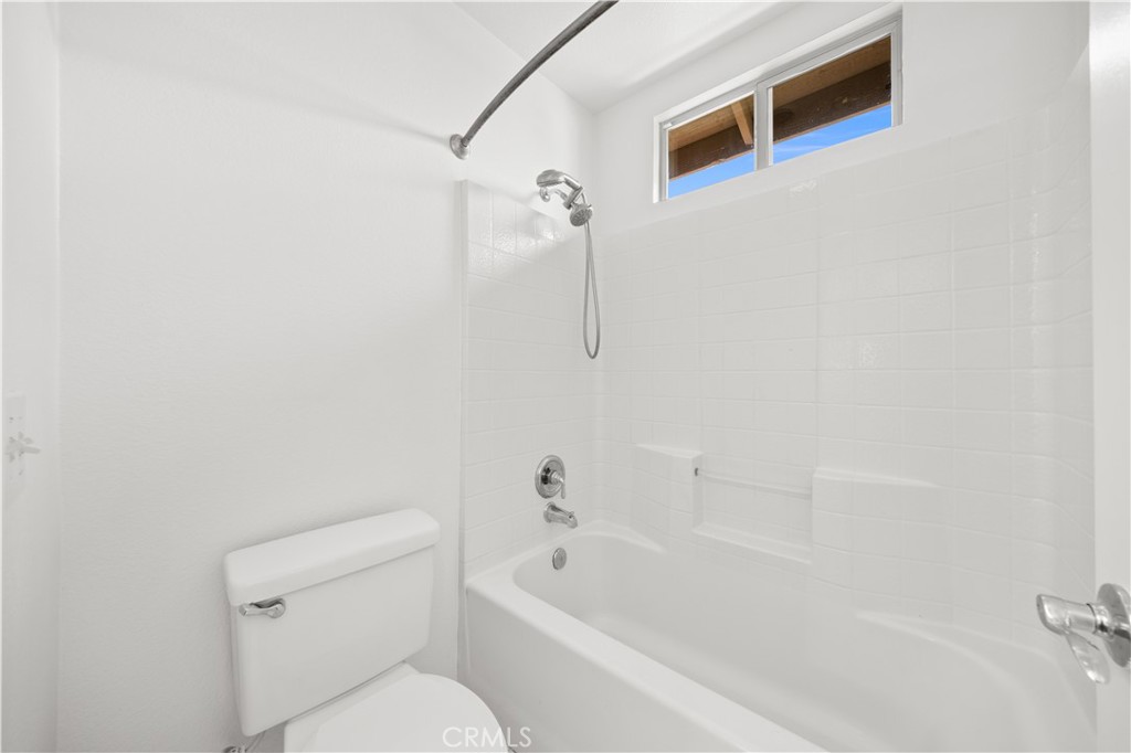 8679 Cabin Place Riverside, CA 92508 - Photo 10 of 35 a bathroom with a toilet a sink and bathtub