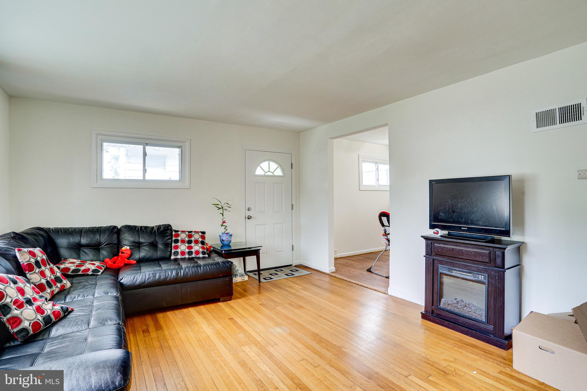 3419 Embry Street Silver Spring, MD 20902 - Photo 9 of 29 LIVING ROOM FROM THE INSIDE STAIRS