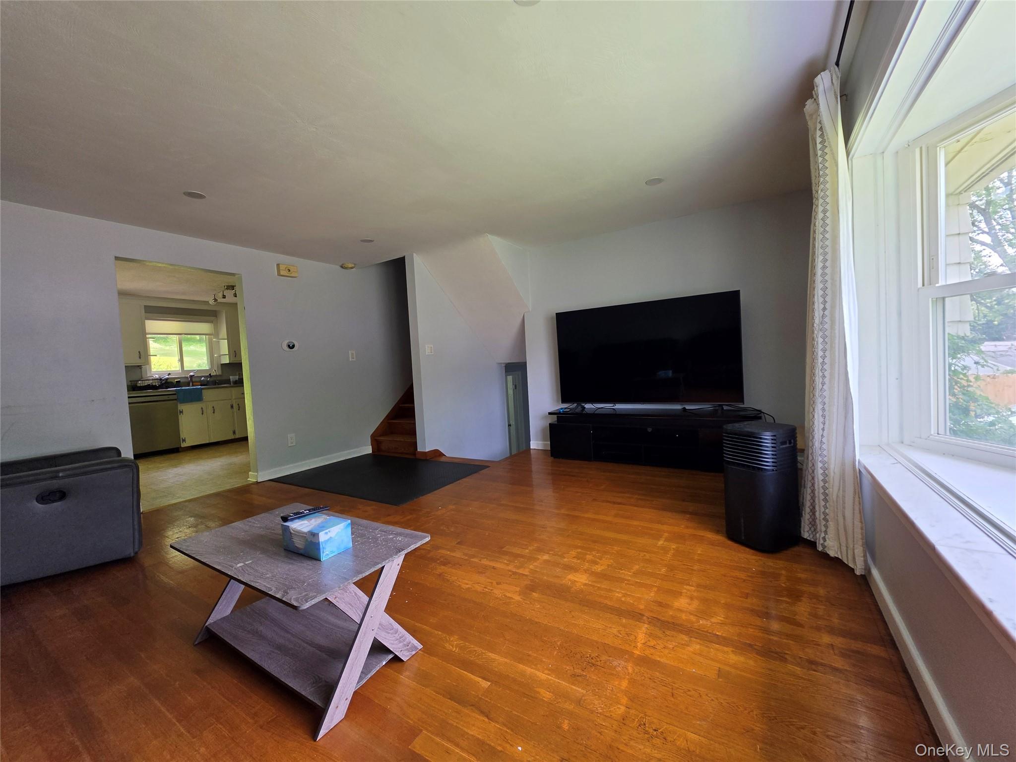 4804 Country Club Road Vestal, NY 13850 - Photo 6 of 15 a living room with furniture and a flat screen tv