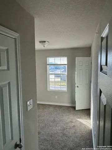 a view of livingroom with hardwood floor and a ceiling fan