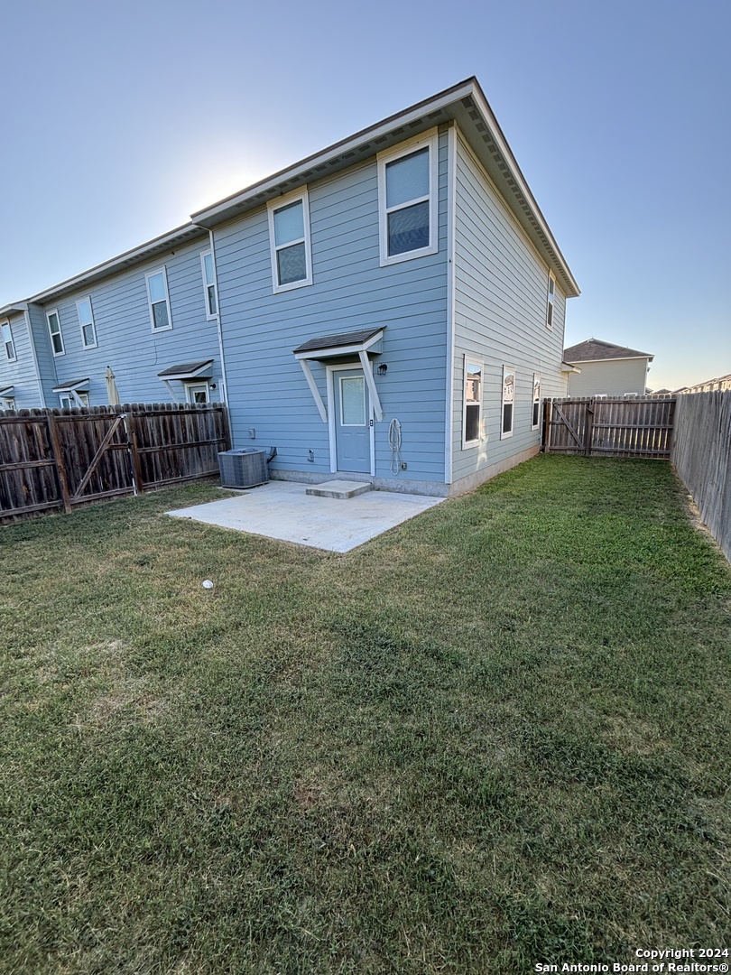 8327 Breezy Cove, Unit 2 Selma, TX 78154 - Photo 6 of 13 a view of a backyard of the house