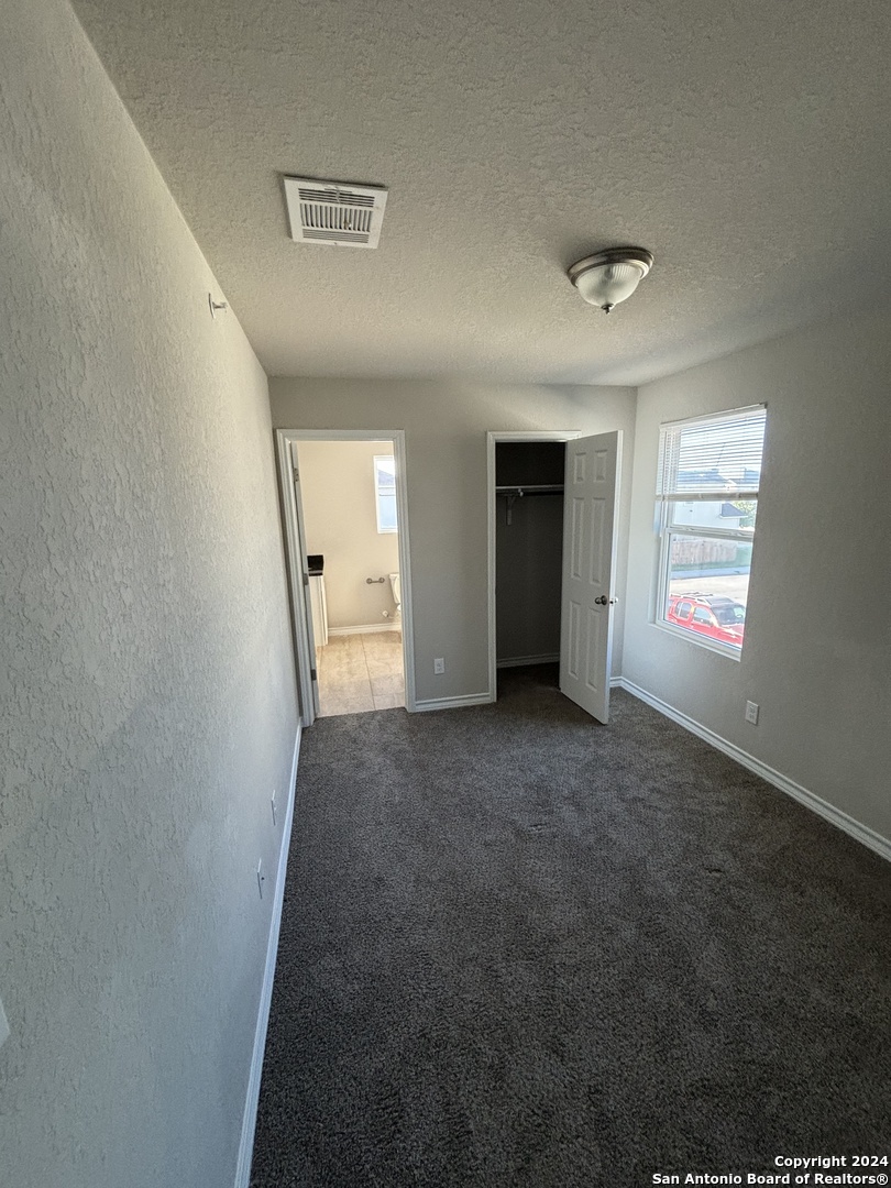 8327 Breezy Cove, Unit 2 Selma, TX 78154 - Photo 10 of 13 a view of a livingroom with an empty space and a window