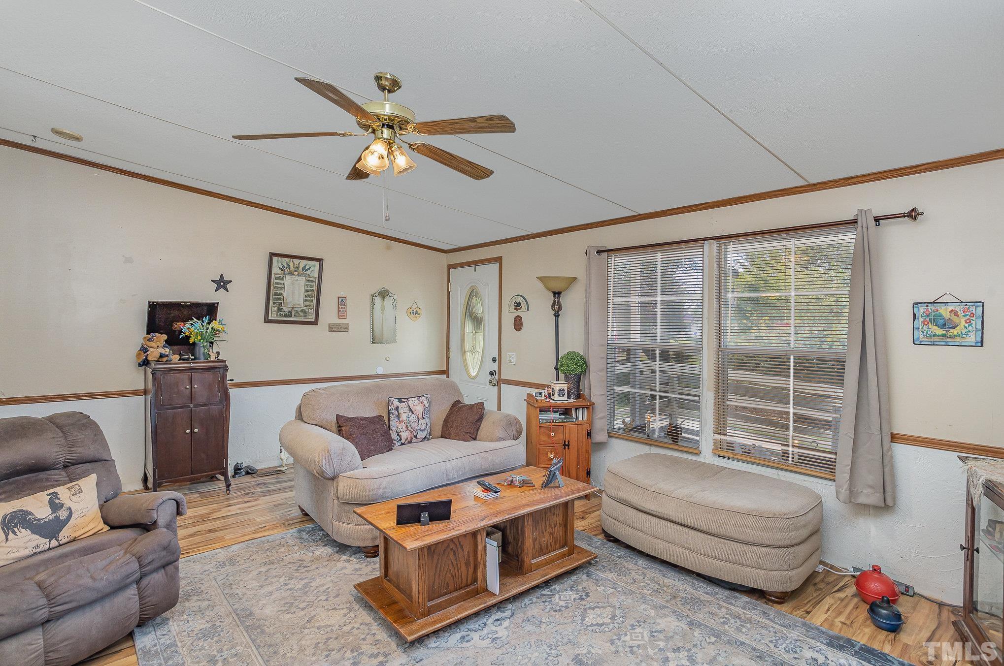 6301 Sandy Creek Road Stedman, NC 28391 - Photo 9 of 27 a living room with furniture and a window