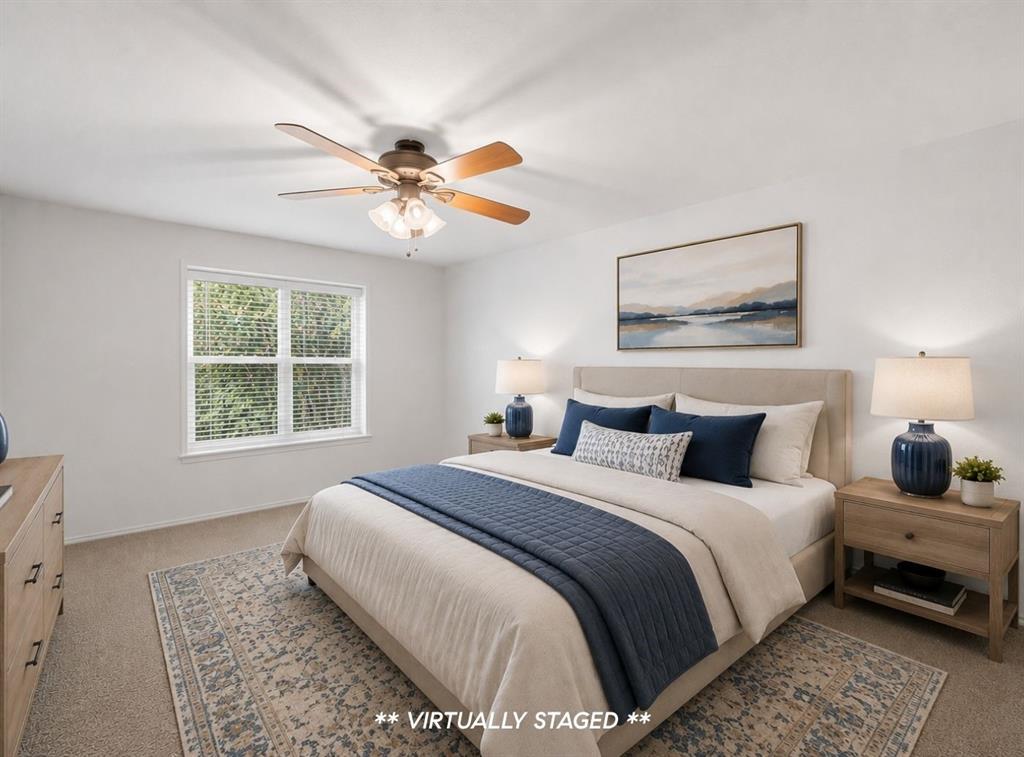 2815 Welborn Street, Unit 101 Dallas, TX 75219 - Photo 17 of 29 Carpeted bedroom featuring a ceiling fan with integrated lighting, a large window with blinds, and white walls