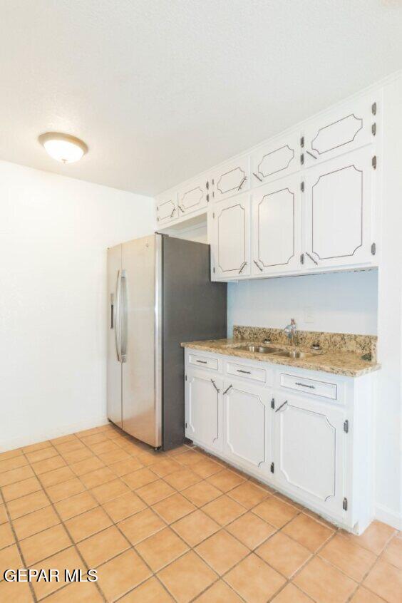 6240 Cibolo Court El Paso, TX 79905 - Photo 12 of 50 a kitchen with stainless steel appliances a refrigerator and cabinets