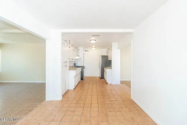 a view of a living room with kitchen island