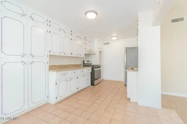 a kitchen with a refrigerator a sink and dishwasher
