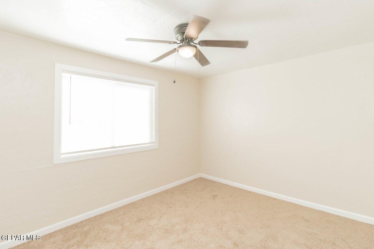 6240 Cibolo Court El Paso, TX 79905 - Photo 24 of 50 an empty room with a window and a fan