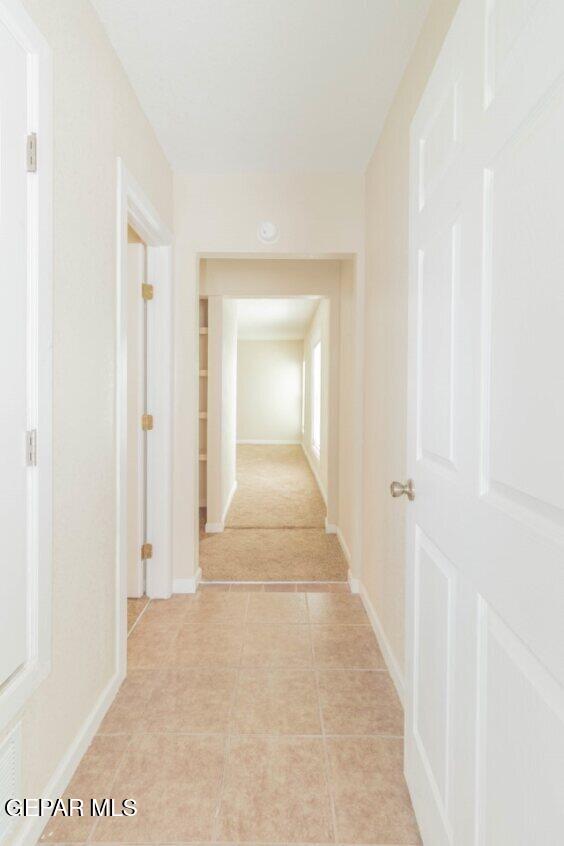 6240 Cibolo Court El Paso, TX 79905 - Photo 29 of 50 a view of a hallway with wooden floor and a bathroom