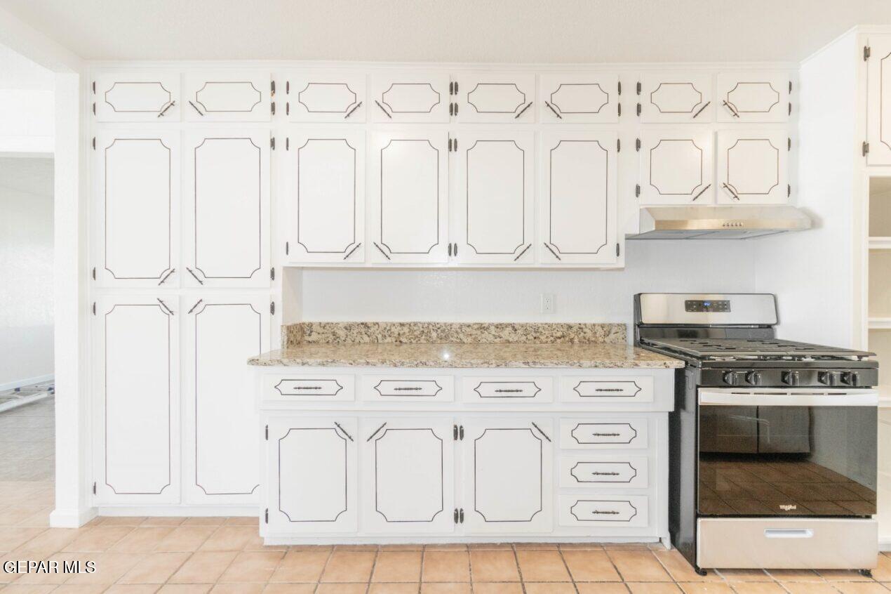 6240 Cibolo Court El Paso, TX 79905 - Photo 3 of 50 a kitchen with white cabinets and white appliances