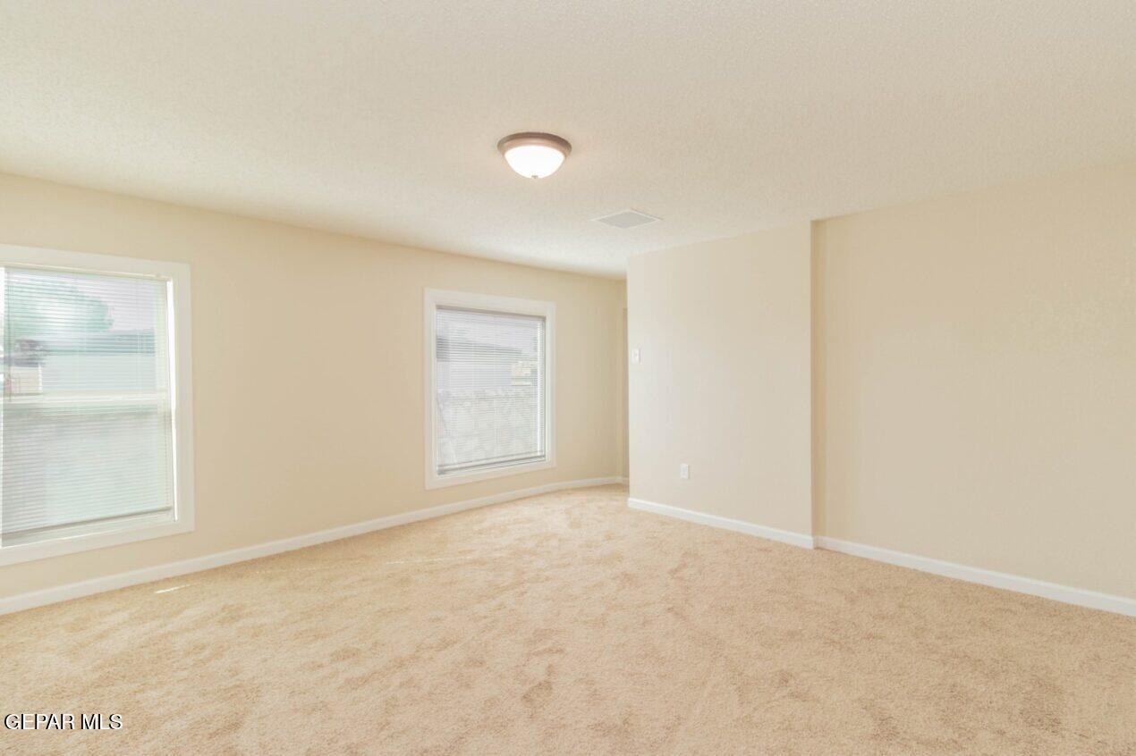 6240 Cibolo Court El Paso, TX 79905 - Photo 35 of 50 an empty room with windows