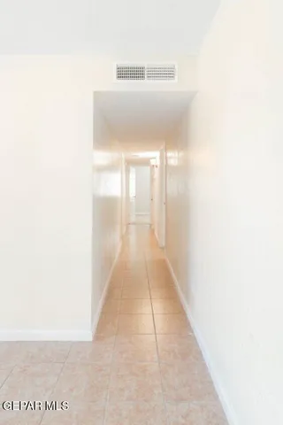 a hallway with a white walls