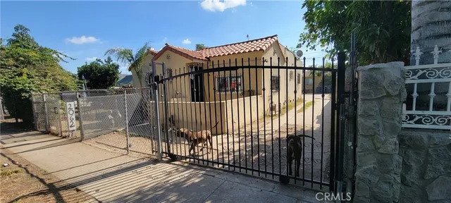 a view of balcony with wooden floor and fence
