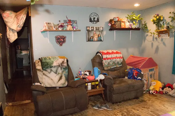 a view of living room with furniture and floor to ceiling windows