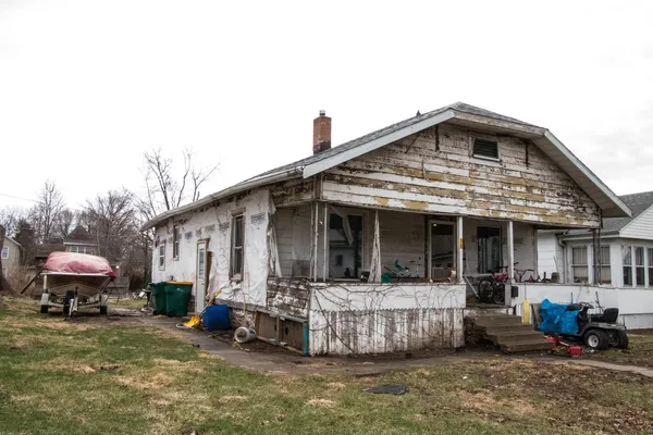 a view of a house with a yard and garage