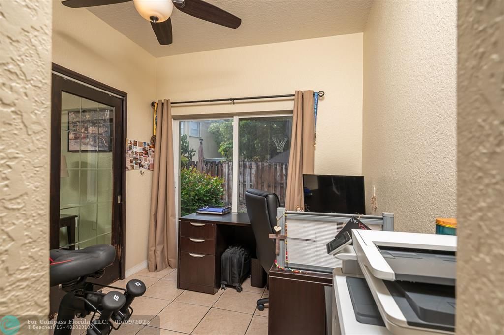 5048 Southwest 136th Avenue Miramar, FL 33027 - Photo 17 of 49 a view of a workspace with furniture and a window