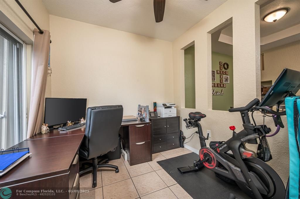 5048 Southwest 136th Avenue Miramar, FL 33027 - Photo 18 of 49 a view of a workspace with furniture and a window