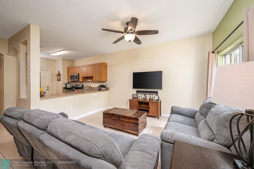 5048 Southwest 136th Avenue Miramar, FL 33027 - Photo 3 of 49 a living room with furniture and a flat screen tv