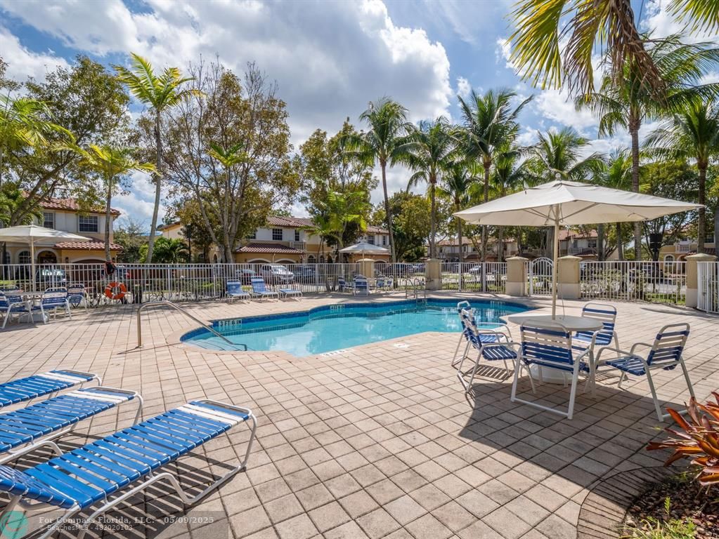 5048 Southwest 136th Avenue Miramar, FL 33027 - Photo 42 of 49 a view of a swimming pool with sitting area