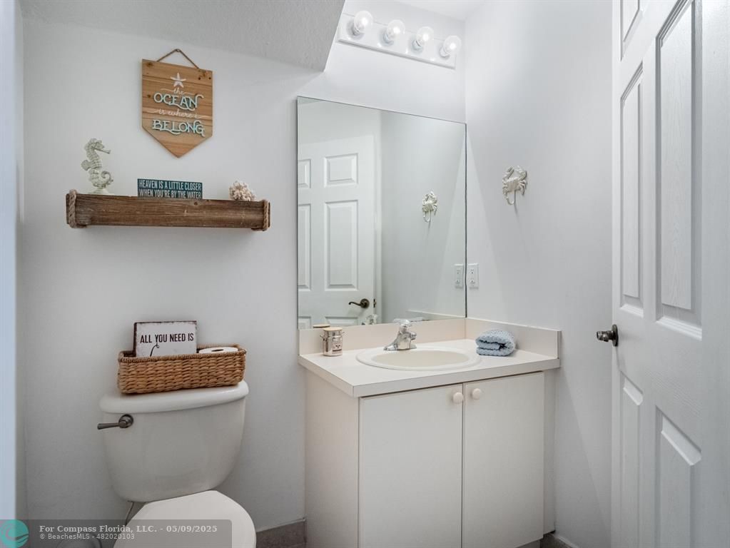 5048 Southwest 136th Avenue Miramar, FL 33027 - Photo 10 of 49 a bathroom with a sink mirror and toilet