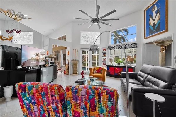 a living room with furniture fireplace and flat screen tv